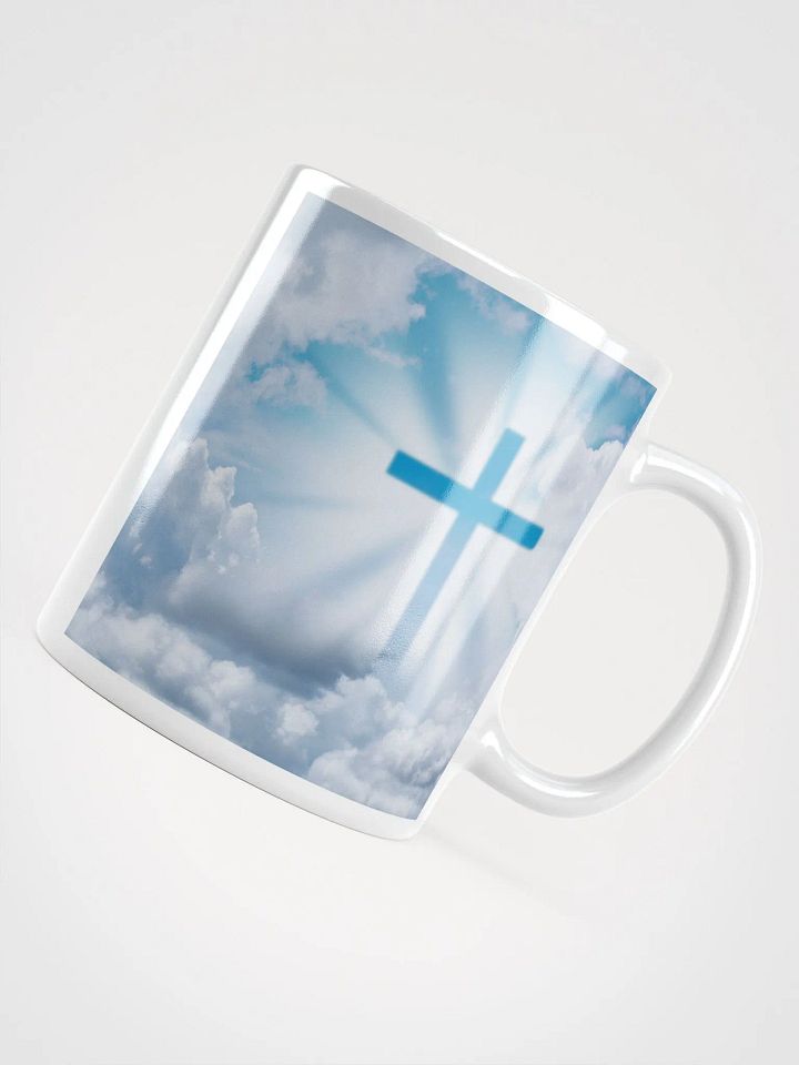 Glowing cross illuminated by intense golden light & a cross surrounded by a heavenly scene, with rays of light shining through soft clouds in a bright blue sky Mug product image (2)