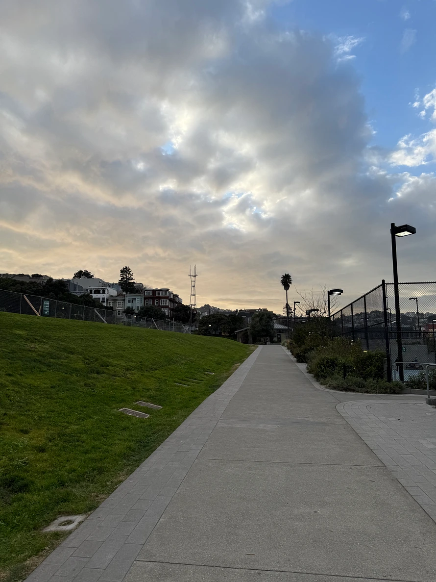 beautiful setting sun over Dolores Park San Francisco with Sutro Tower in the distance