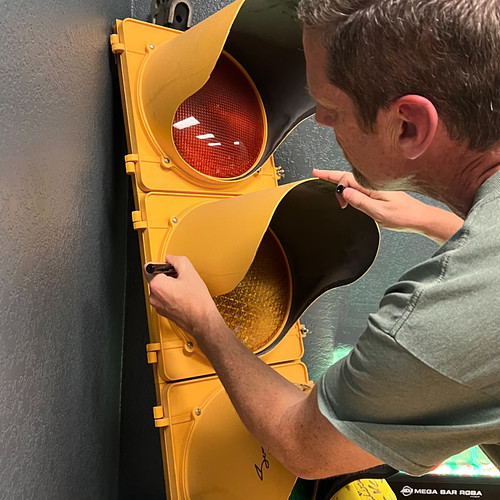 Chris from @destiny_rescue signing the traffic light after recording an episode with us