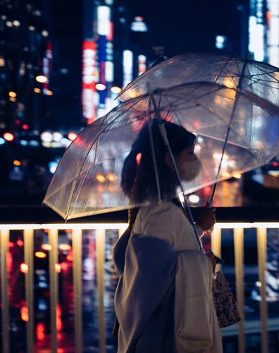 There's something magical about the way neon lights filter through transparent umbrellas.

Captured somewhere near Osaka Stat...