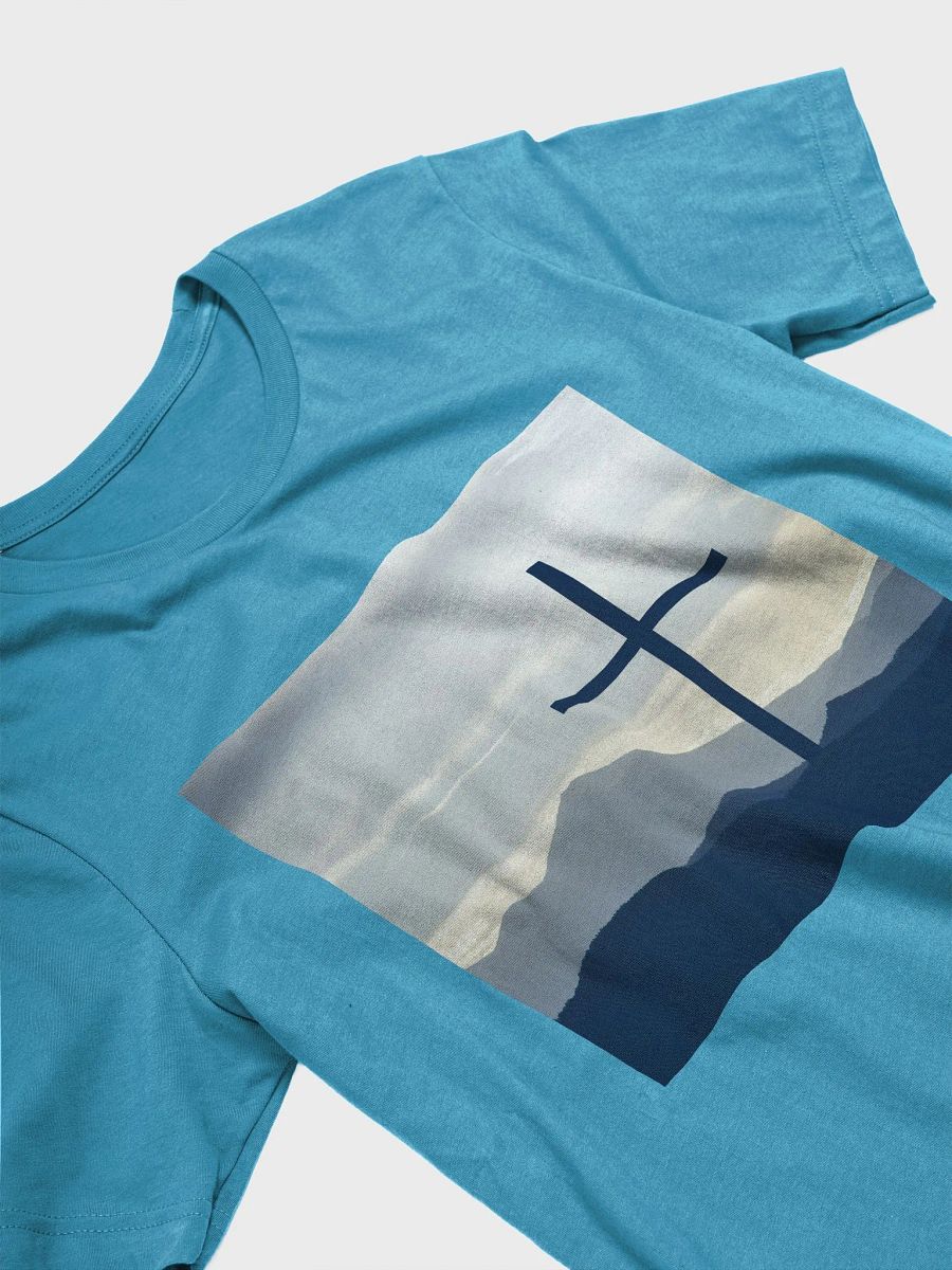 A cross standing against a serene landscape of rolling hills and distant mountains under a soft, cloudy sky t-shirt product image (8)