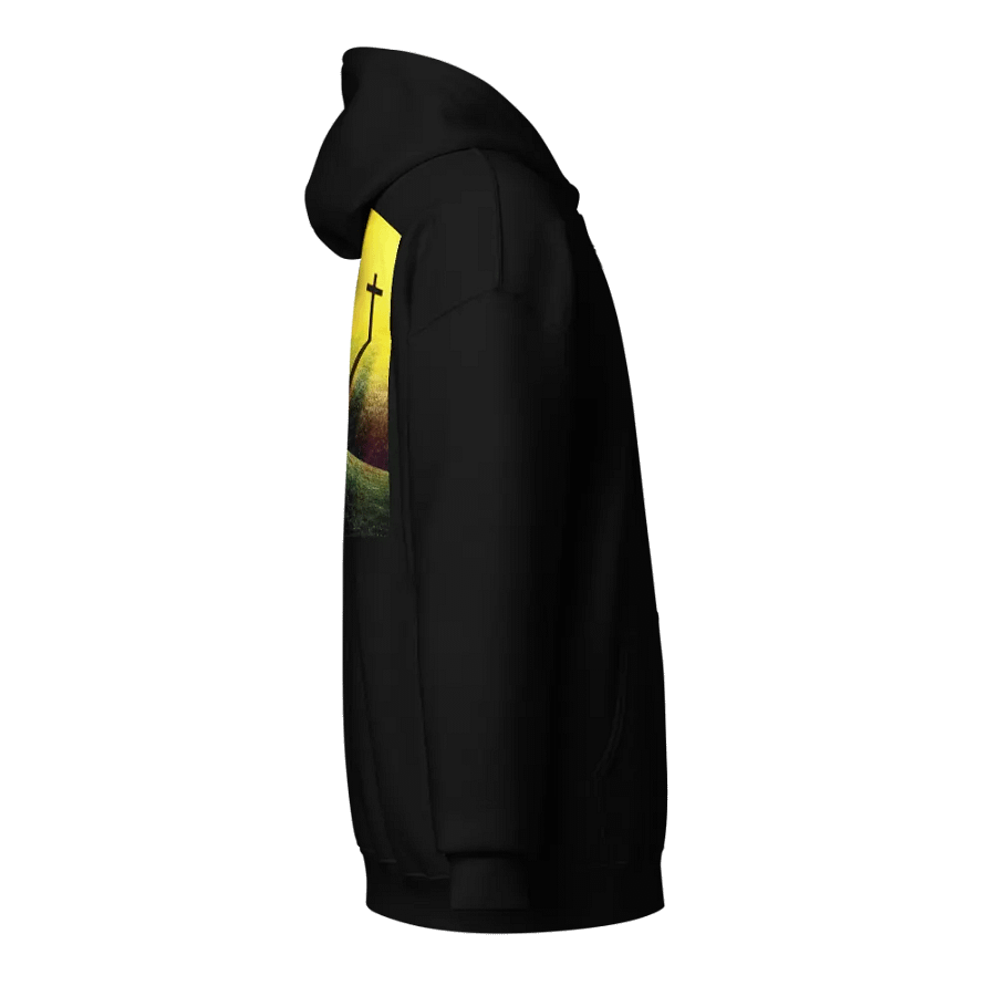 A cross standing prominently on a grassy hill, with a vivid, dramatic background Hoodie product image (4)