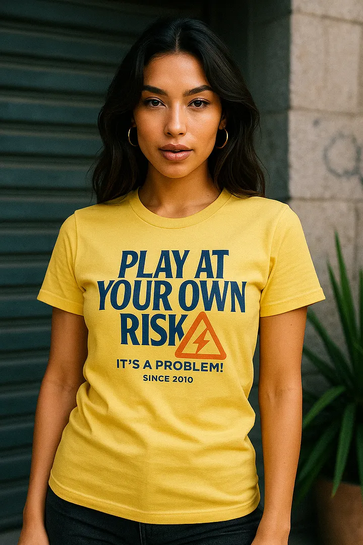 "PLAY AT YOUR OWN RISK" - Statement Graphic Tee product image (1)