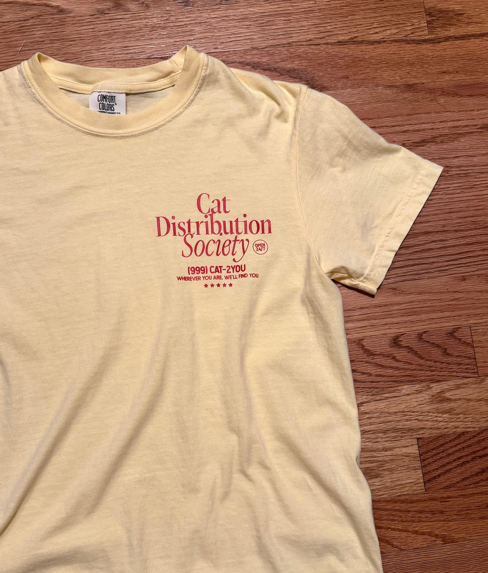 Cat distribution society oversized unisex tee (orange text) product image (3)