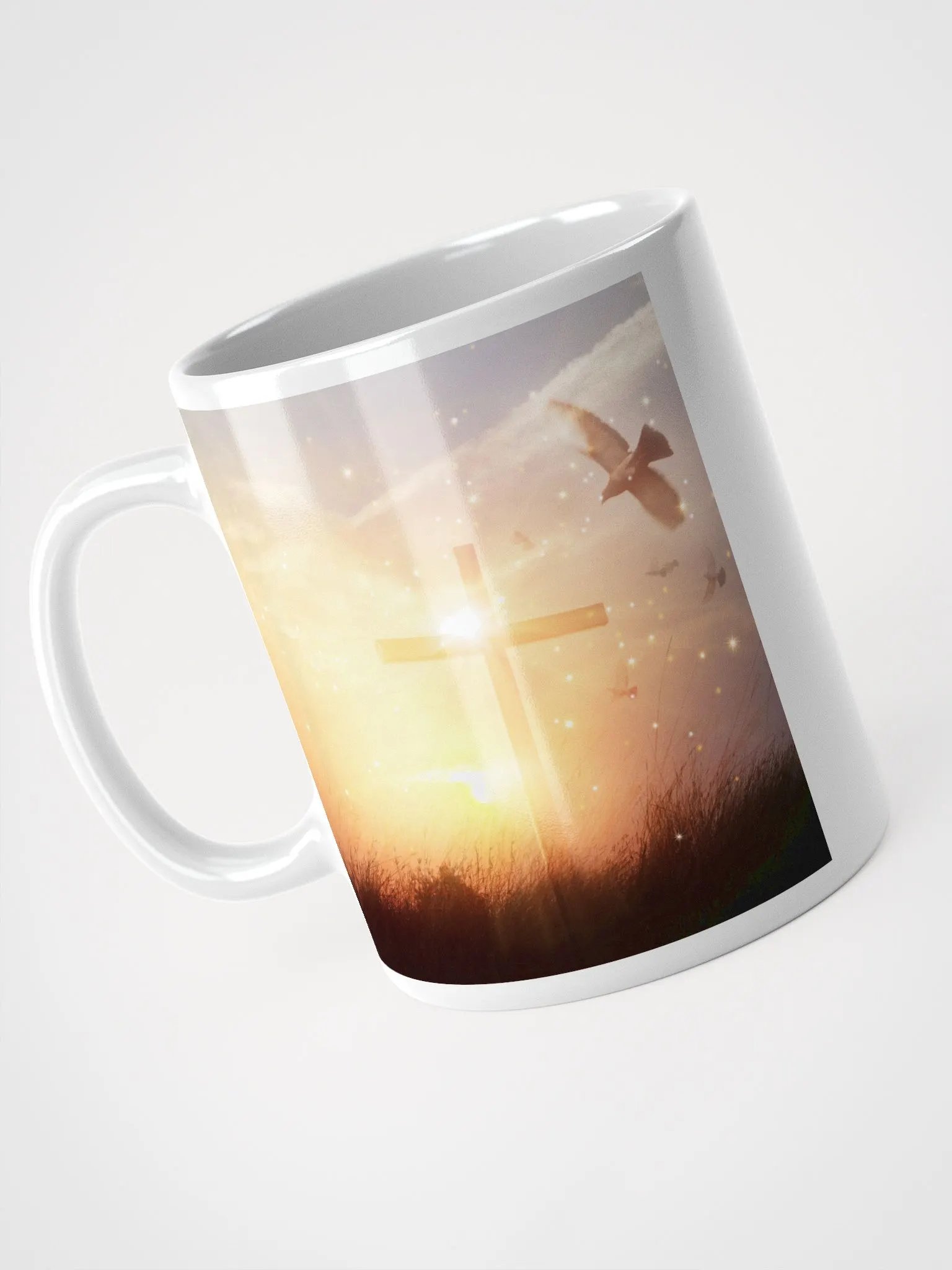 A cross standing against a serene landscape of rolling hills & a Radiant cross illuminated by a bright, golden light with glowing sunrise & doves Mug product image (6)