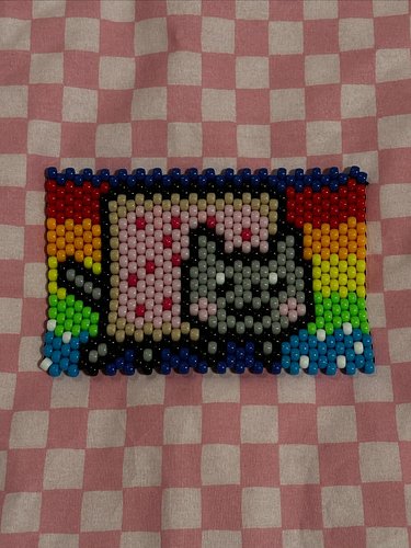 Nyan Cat Panel!! 🌈 
kandi pattern by: cakeraen
.
.
.
#kandi #kandipanel #nyancat #plur #beads #ponybeads