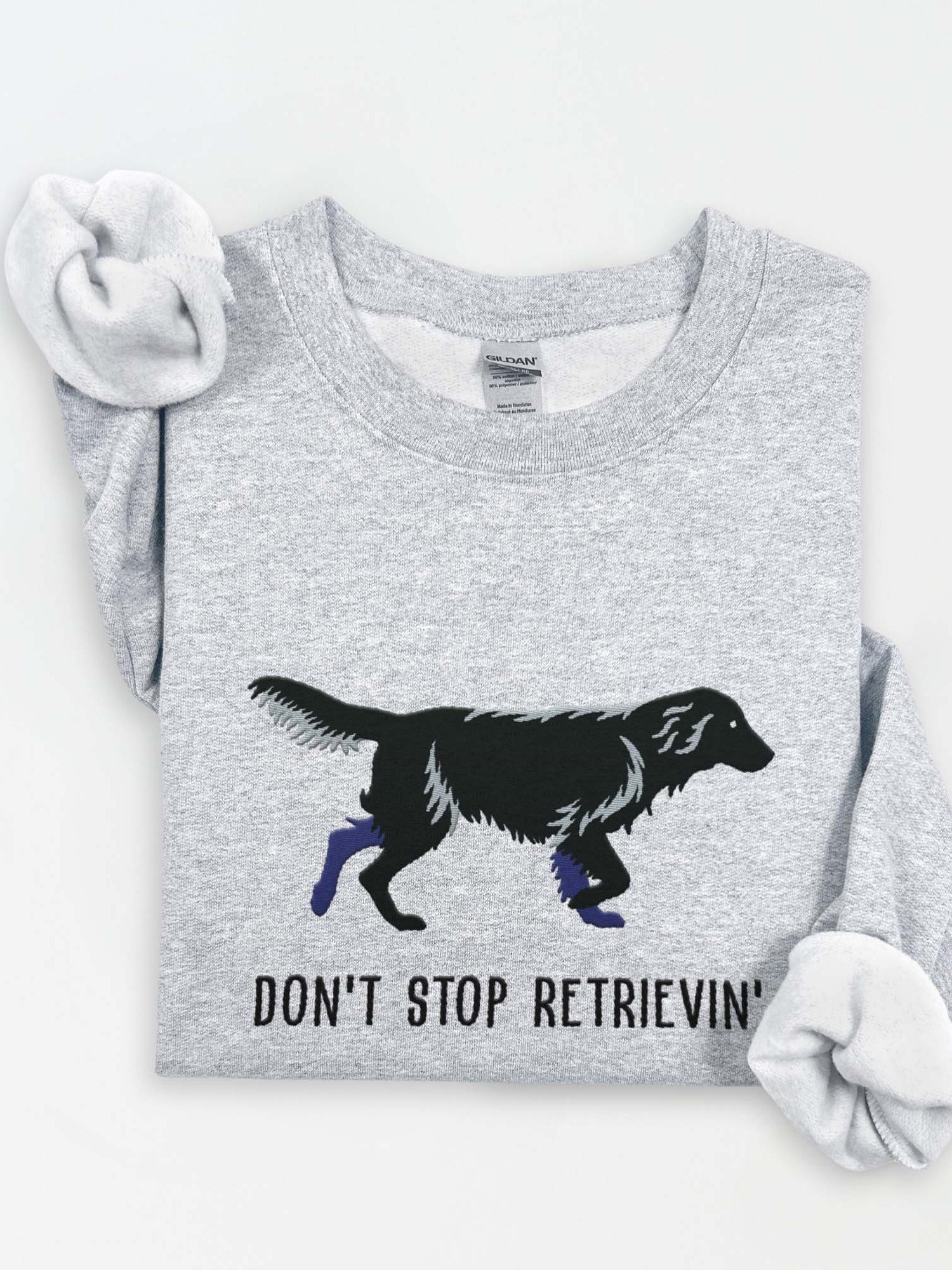 Don't Stop Retrievin' Sweatshirt (Embroidered) of a Flat Coated Retriever(Black) product image (1)