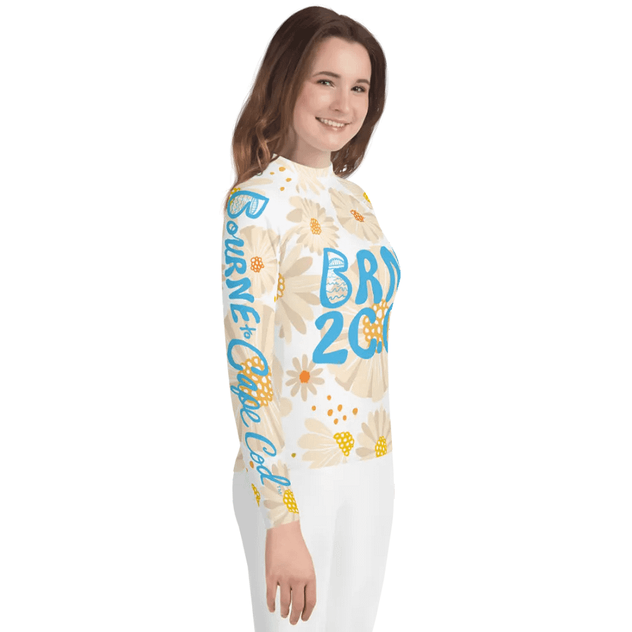 Girls' | YOUTH | Rash Guard | BRN.2C.C.™ Front Graphic | BOURNE to Cape Cod™ Sleeve & Back Logo | Coastal Swim Shirt for Kids | UV Protection Activewear | Blue Logo | Daisy Pattern product image (4)