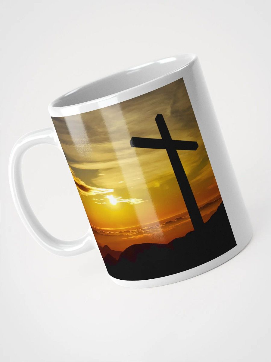 Large cross silhouetted against a dramatic sunset & a cross placed on top of a rocky hill, bathed in the warm glow of a sunrise or sunset Mug product image (3)