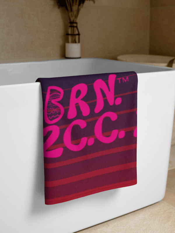 BOURNE to Cape Cod™ | Coastal Classic Beach Towel | All-Over Logo Print | Vibrant Pink Logo on Bold Purple and Pink Stripes product image (2)