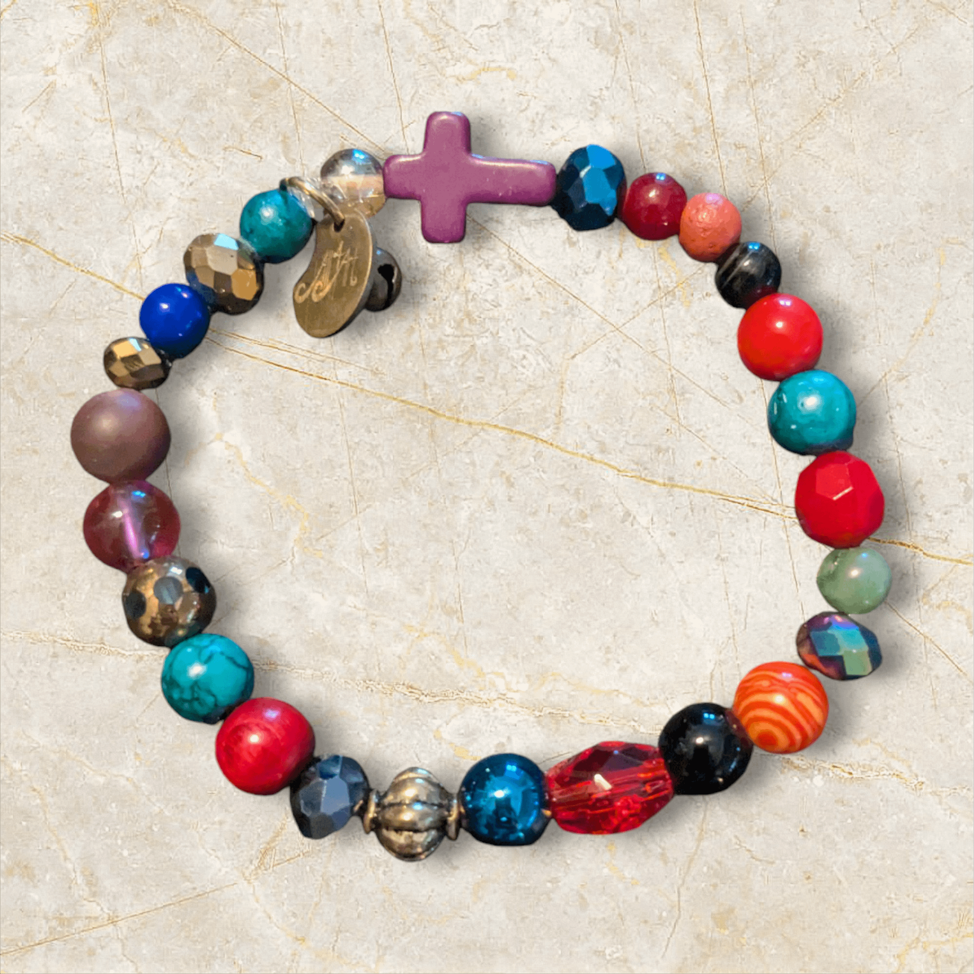 Handmade Multi Color Bracelet with Purple Cross & Bell product image (1)