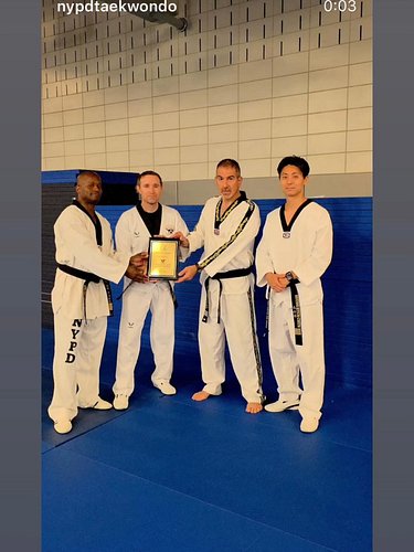 Presentation of the plaque to NYPD’s Taekwondo Team for amazing work in the Global Traditional Taekwondo Federation’s kick-a-...