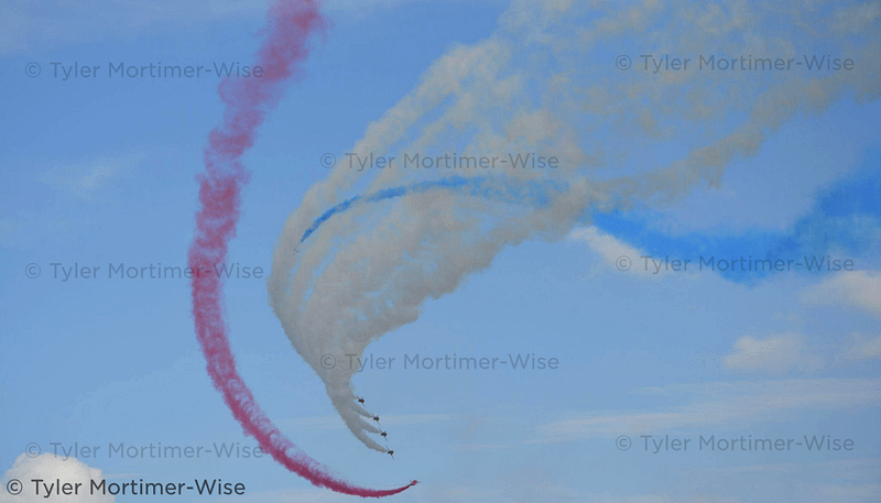 Red Arrows Twisting (Digital Photo)