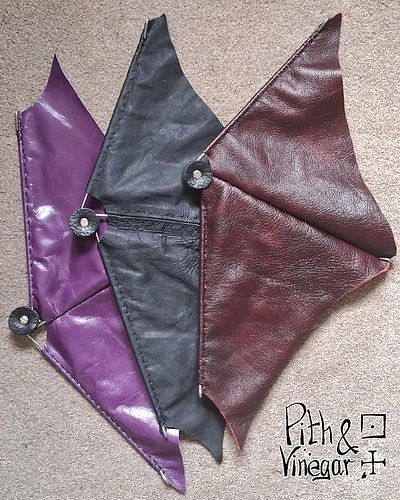 Because sometimes bracers just aren’t dramatic enough.

These dragon wing fans are handcrafted, hand-stitched, and designed f...