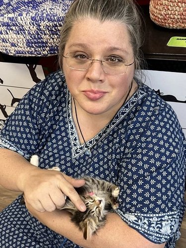 Help! What do I do?! 🤣 😭 We stopped at a #catcafe and this little girl immediately came over to me and settled right in. She'...