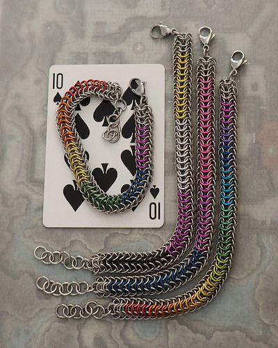 a rainbow chrome version of the helios bracelet has entered the chat! it joins the rainbow stripes, nonbinary, and bisexual p...
