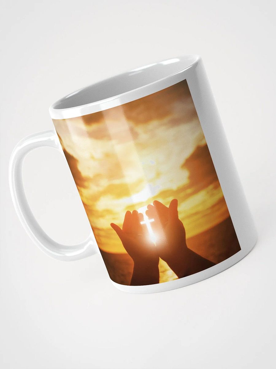 Cupped hands holding a glowing cross silhouette & Wooden cross being held up against the backdrop of a sunrise Mug product image (6)