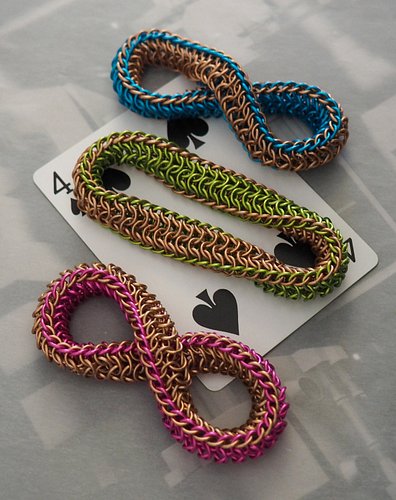 the lucky penny trio of mobius fidgets are here! they are copper paired with your choice of bubblegum pink, lime green, or aq...
