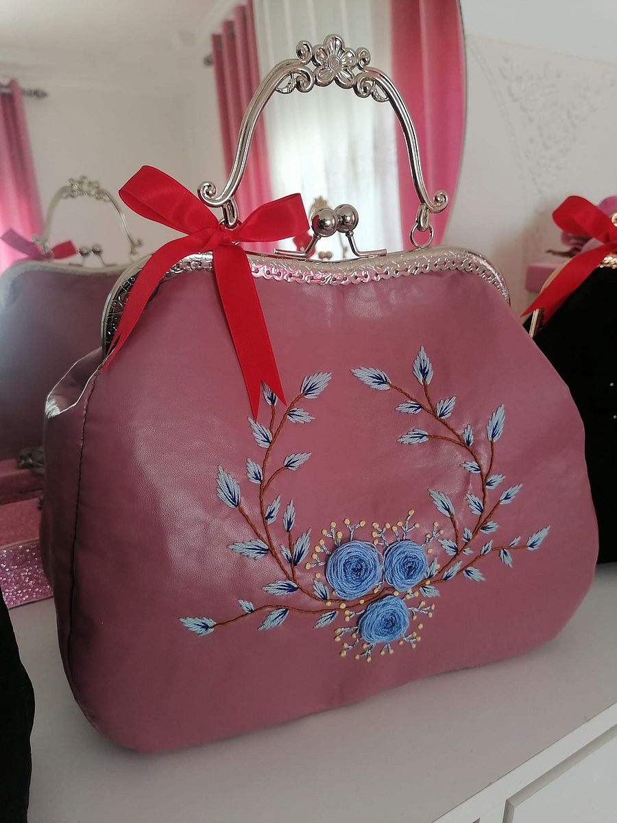 Pink leather handbag product image (1)