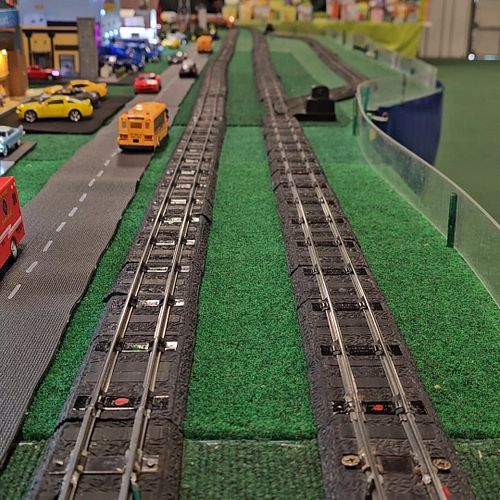 Looking down on trains as the pass. #trainshow #OT&WTrainShow #OT&WTrainShow2024 #modelrailroad