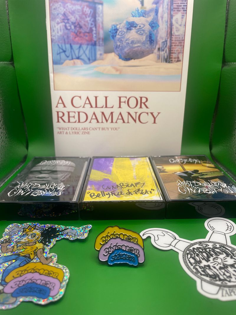 “Epitaph Stone Deluxe & Amethyst Jalebi” - “What Dollar$ Can’t Buy You / Belly Full Of Roti” 2X Limited Edition Cassette Bundle