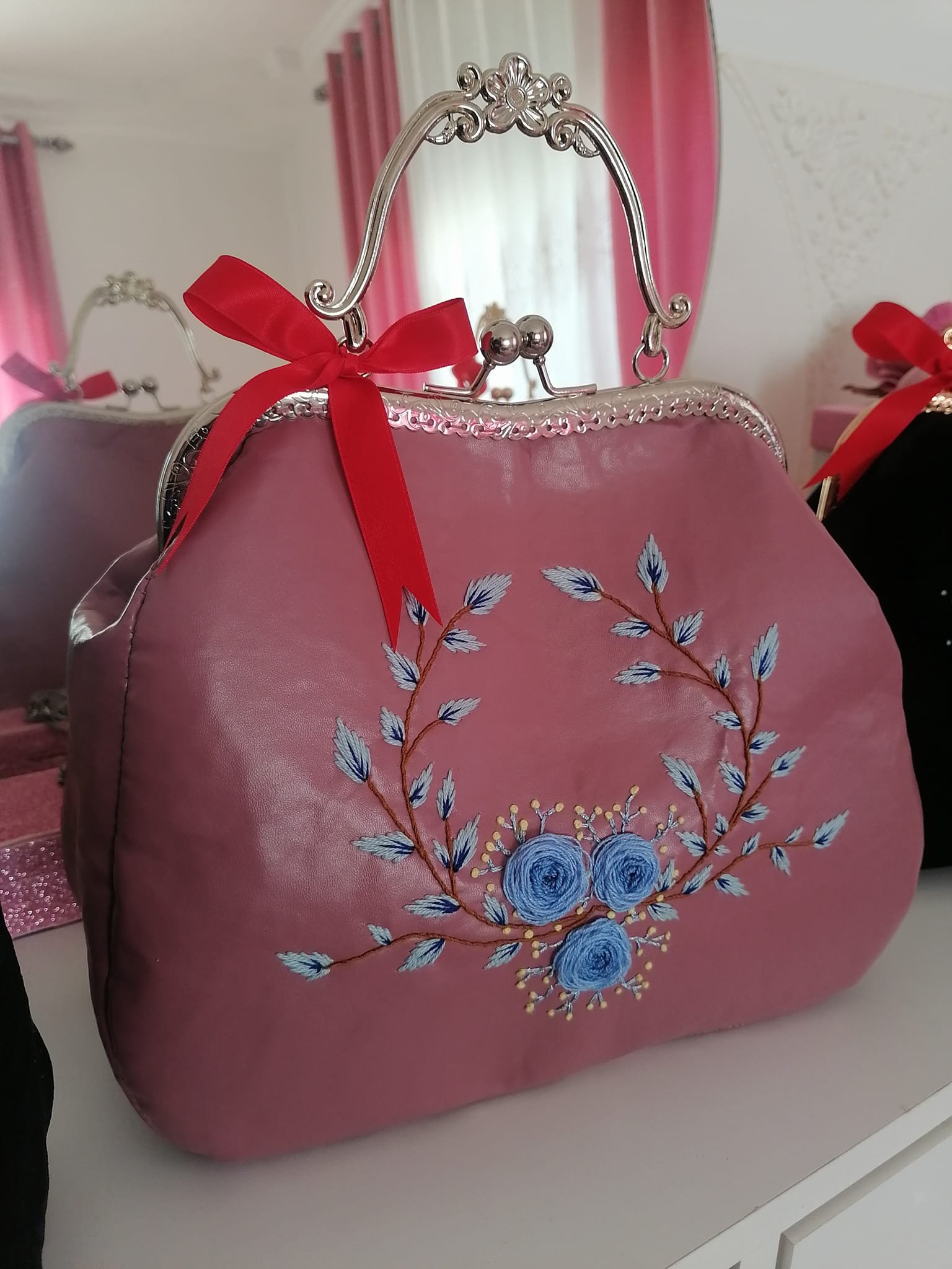 Pink leather handbag product image (1)