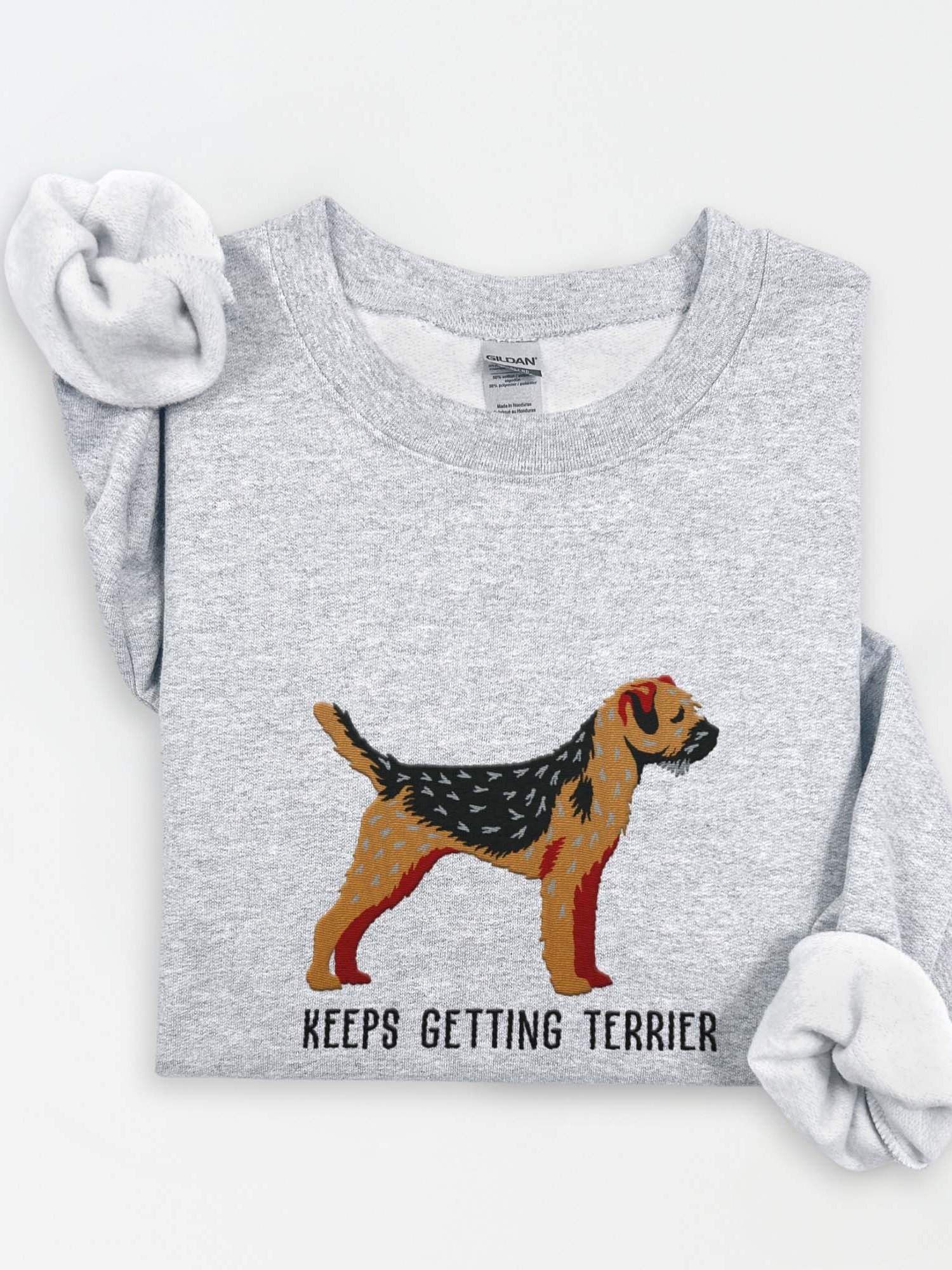 Keeps Getting Terrier Sweatshirt (Embroidered) of a Border Terrier(Black & Tan) product image (1)