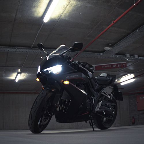 Saturday night. 
The world gets louder... 
so I slip into the quiet. 
Engine cold, 
helmet buckled, 
mind heavy. 
But not for...