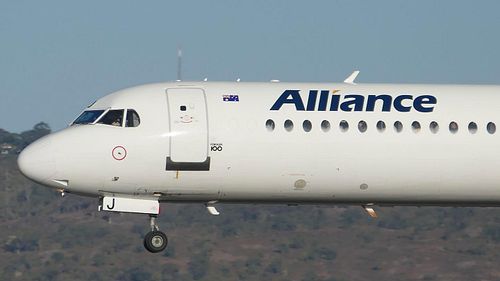 Up Close To An Alliance Fokker 100 Arriving on Runway 03 at Perth Airport