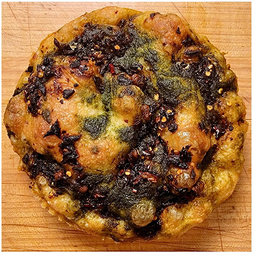 Chili Crisp and Stinging Nettle Pesto Focaccia!

I had let this dough almost over proof. When I went to dimple it, I noticed ...