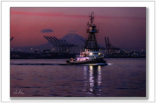Early morning sunrise over Port of Seattle WA.
With the tug AJ light boat in the harbor.
Www.twinanchorapparel.com 
Www.jason...