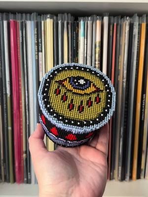 my latest plastic canvas container, i'm calling it the sick eye. this pattern is available on my website tomorrow, along with a full tutorial on my blog there! kind of obsessed with making random containers, i want a million more!!! #crossstitch #needlepoint #plasticcanvas #tattoo #altart 