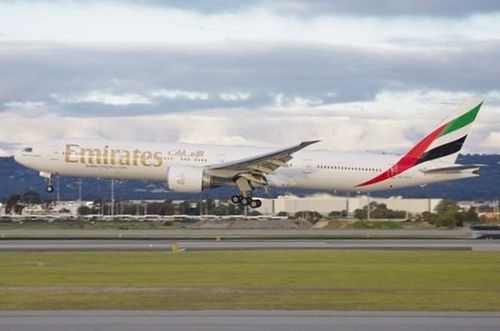 Emirates 777 Landing in July, 2022 on RWY 03 [Taken on an old camera so slightly pixelated]
