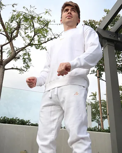 now available in season 2 the white ‘drip’ sweat set, premium cotton, embroidered, orange on white