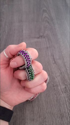 the two tone steel mobius fidgets are now live. one is green plus purple and the other is red plus black.

made with the heft...