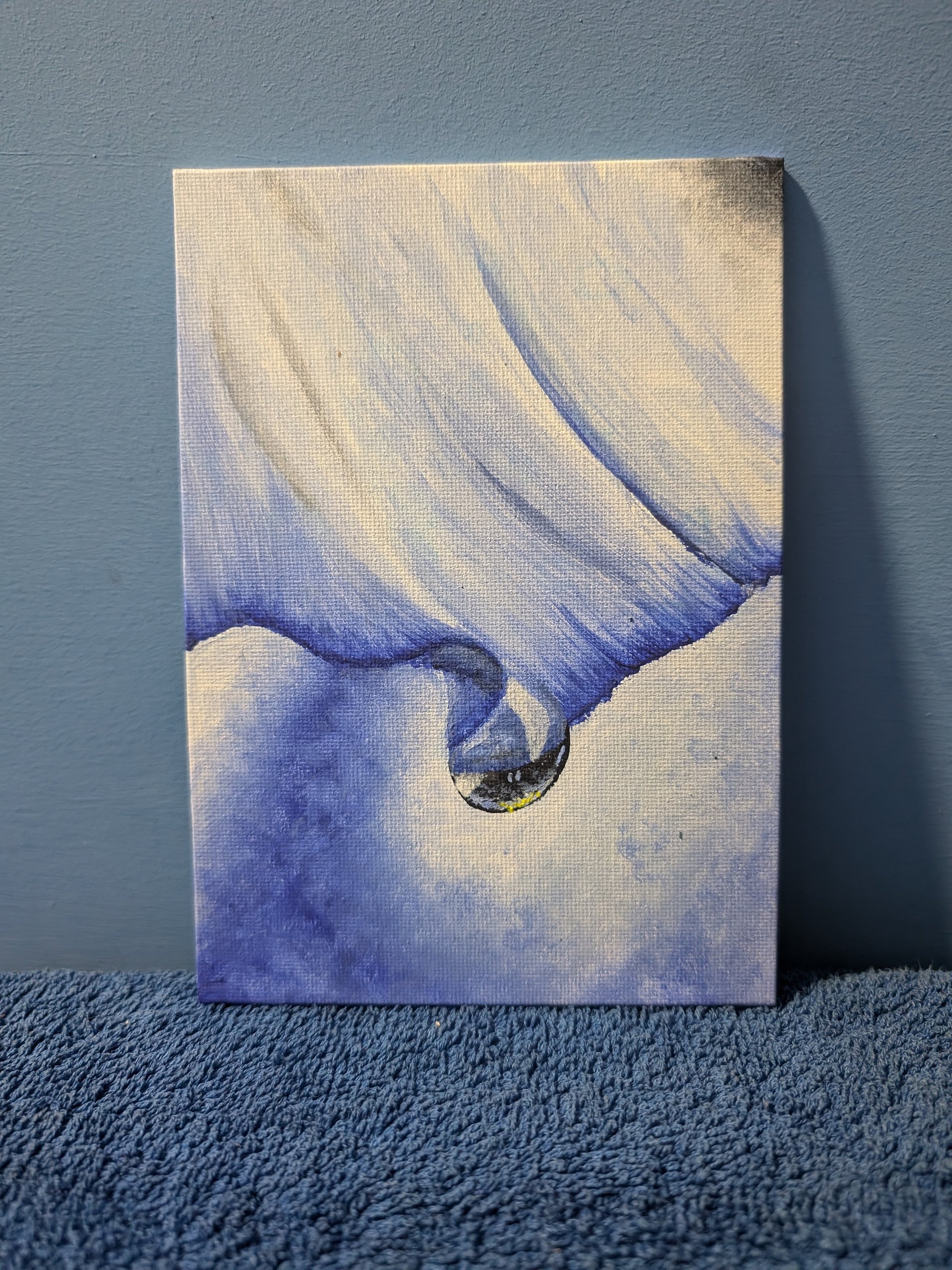 Water droplet slides off a petal product image (1)