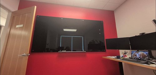 Thank you all for the help today! 7 people and an hour later. 100lbs is now hanging from the office wall with ease. It's safe...