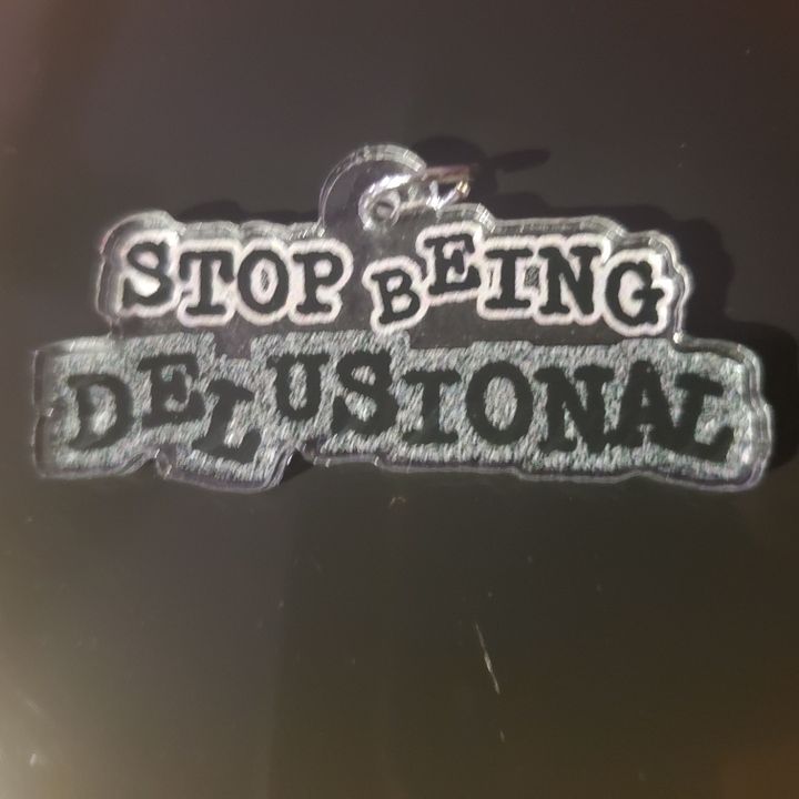 Stop Being Delusional Charm product image (1)