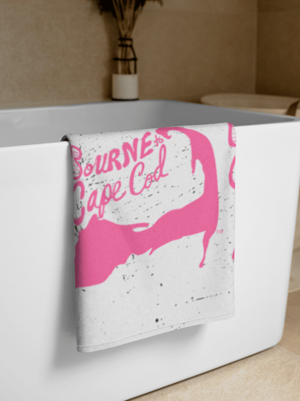 BOURNE to Cape Cod™ | Coastal Classic Beach Towel | All-Over Logo Print | Light Pink Logo on a Distressed Background product image (2)