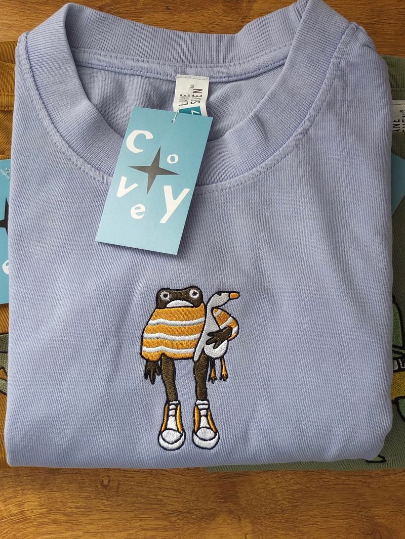 Frog Holding Goose Tee