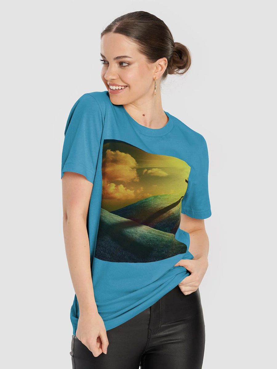 A cross standing prominently on a grassy hill, with a vivid, dramatic background t-shirt product image (3)