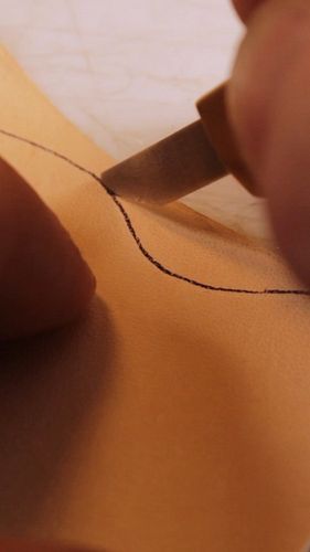 Precision cutting a minimalist wallet! ✂️ #LeatherCraft #SlimWallet