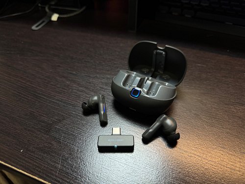 Gaming in bed just hit a new level! A USB dongle transforms wireless earbuds into low-latency beasts—no more lag, just pure i...
