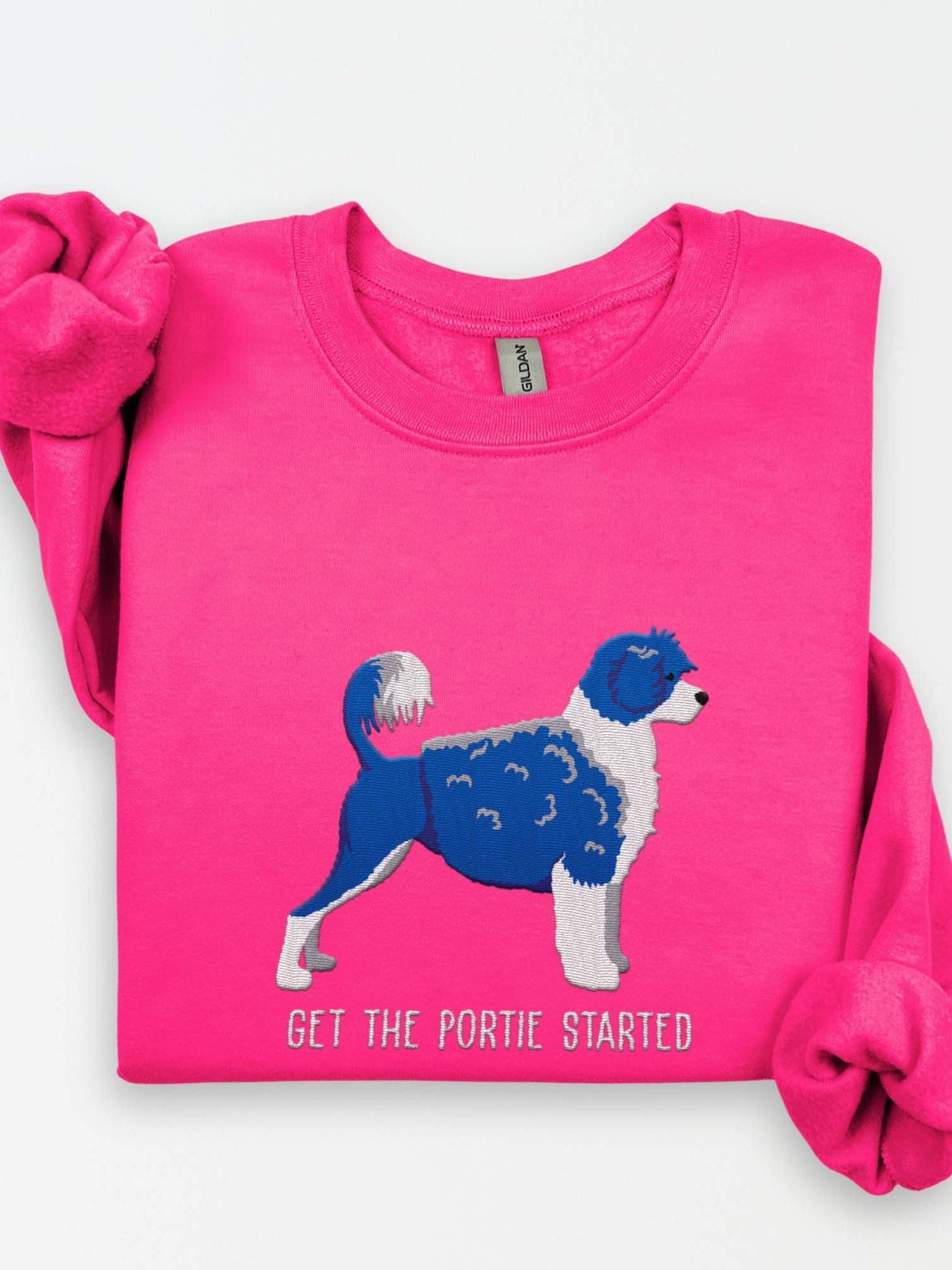 Get the Portie Started Sweatshirt (Embroidered) of a Portuguese Water Dog(Blue & White) product image (1)