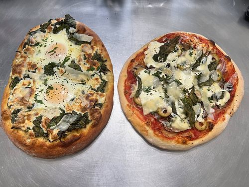 Fiorentina Pizza from 
@iamginodacampo Cookbook The Italian Escape with Spinach, Fresh Mozzarella, and Farm Fresh Eggs topped...