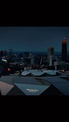 Mercedes Benz Stadium 🏟️ looking like the #batcave with #atlanta skyline transitioning from dusk to night. #dronevideo #merce...