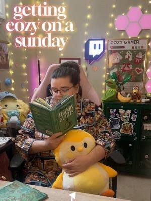 Getting all snuggled up in @printfresh PJ's in my little streaming nook with my @finchcare plush! Cozy Sunday essentials: my current read, trusty Kindle, a candle that smells like dreams, and some art I've been making inspired by the game Palia!! Wishing YOU the most amazing week ahead, because you so deserve it, friend 🥹💛 #cozygames #streamersetup #kindle #kindlereader #paliagame #finch #cozyaesthetic #selflove #selfcare #booktok #cozycorner #digitalart #printfresh #wholesomecontent #gamergirl #cozygames #palia