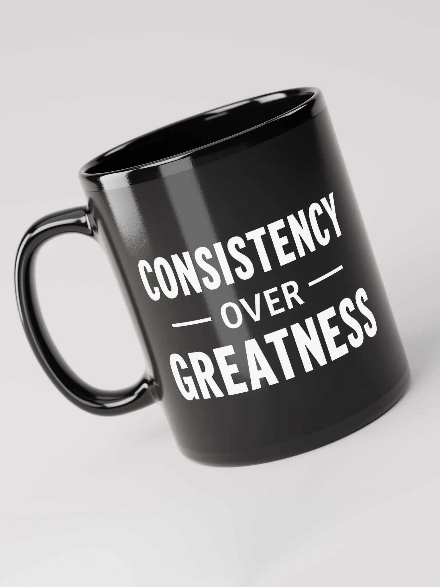 Unleash Your Inner Champion: The Rock’s Consistency Over Greatness Mug – Fuel Your Journey, One Sip at a Time product image (3)