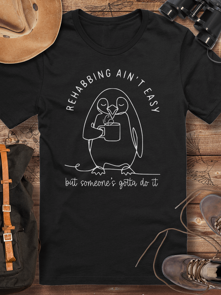 Funny penguin rescue tee, wildlife rehabber gift, rehabbing ain’t easy, animal carer gift, penguin lover tee, cute animal rescue, wildlife rehabber shirt, funny wildlife carer appreciation tshirt product image (1)