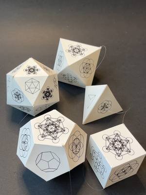 Platonic Solids Up Close - Each one carries its own symmetry, beauty, and balance — little universes in themselves. From simple cardstock to shining holographic paper, geometry comes alive in every fold and edge. They are not only mathematics — they are art in motion, expressions of timeless harmony. Simple folds… infinite possibilities. Let your imagination soar, and discover what you can create. See lessons in Hands-On Zone — link in bio! #PlatonicSolids #SacredGeometry #GeometryArt #HandsOnZone #DIYInspiration #MobileArt